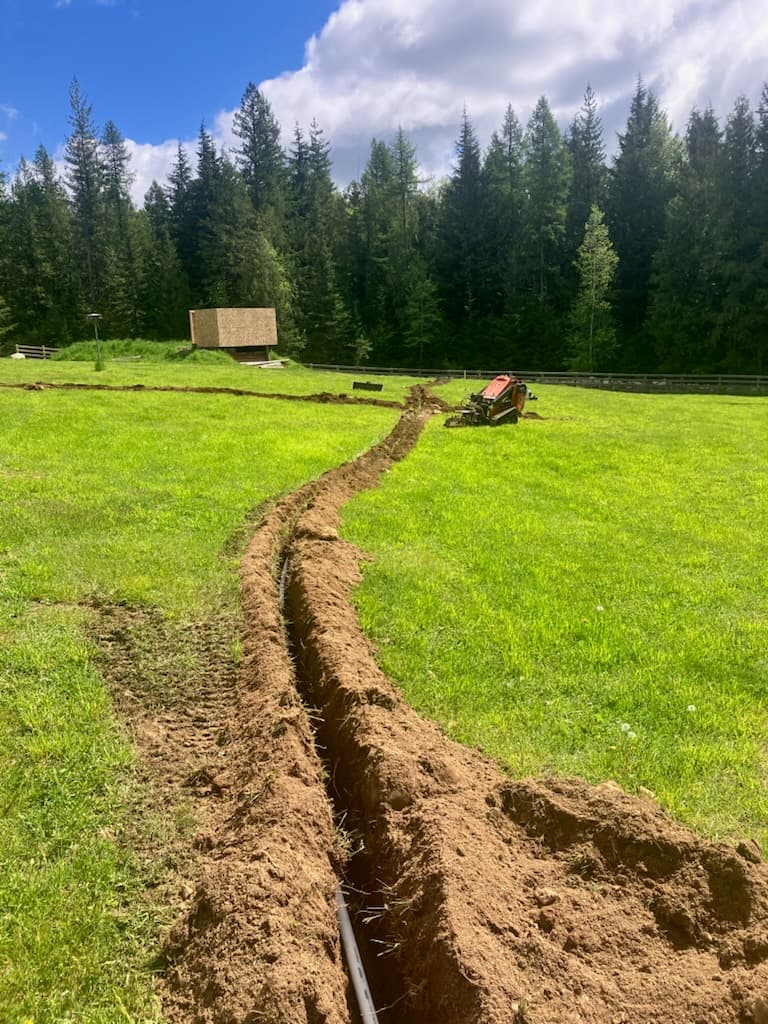Irrigation pipe trenching installation in progress